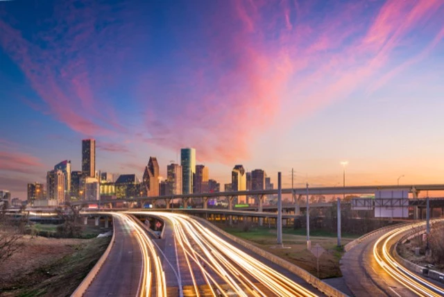 Houston, Texas, USA downtown skyline over the highways at dusk. For long distance commuting to and from Houston